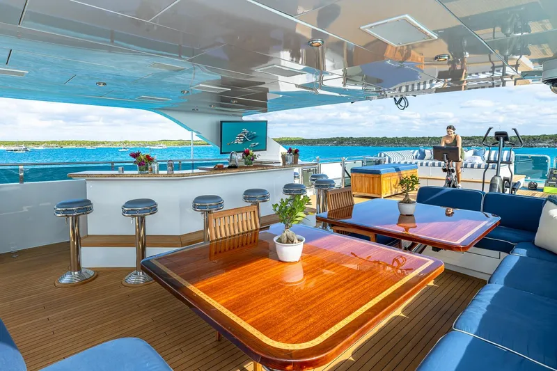 Lady Joy Yacht Photos Pics Luxurious 2007 Christensen Tri-Deck yacht with elegant outdoor seating and bar area.