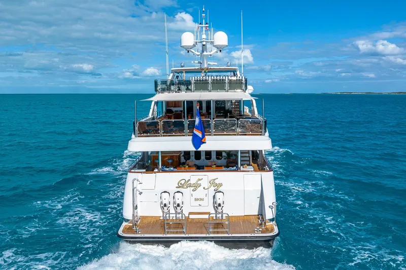 Lady Joy Yacht Photos Pics Luxury Christensen Tri-Deck yacht cruising in open ocean, 2007 model.