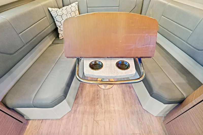 Well Told Yacht Photos Pics Interior of 2019 Formula 430 CROSSOVER with gray seating and table.