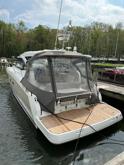 Small Batch Yacht Photos Pics 2016 Jeanneau Leader 36 yacht docked at a marina with a covered cockpit.