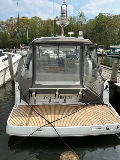 Small Batch Yacht Photos Pics 2016 Jeanneau Leader 36 yacht docked at marina, rear view with canopy.