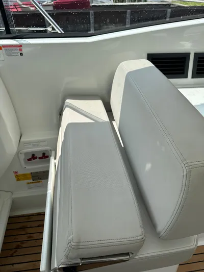Small Batch Yacht Photos Pics 2016 Jeanneau Leader 36 boat interior seating with white upholstery.