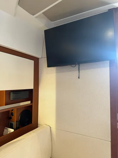 Small Batch Yacht Photos Pics Flat-screen TV in the cabin of a 2016 Jeanneau Leader 36 yacht.