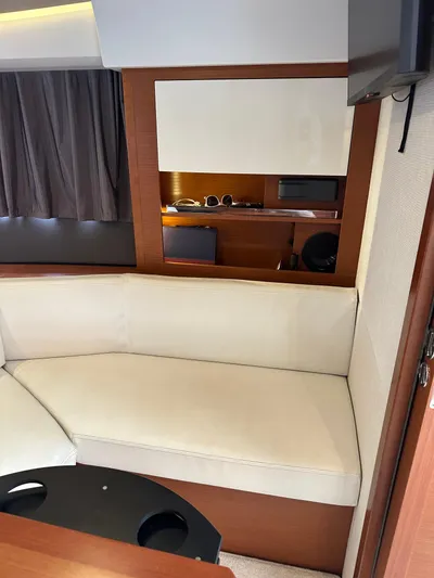 Small Batch Yacht Photos Pics Interior seating area of a 2016 Jeanneau Leader 36 yacht.