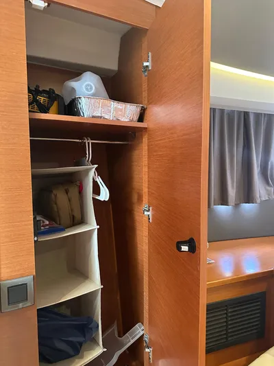 Small Batch Yacht Photos Pics Wooden closet interior on a 2016 Jeanneau Leader 36 boat.