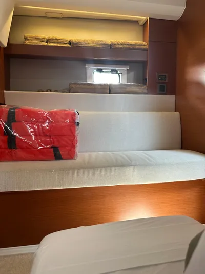 Small Batch Yacht Photos Pics Interior cabin of 2016 Jeanneau Leader 36 with seating and storage.