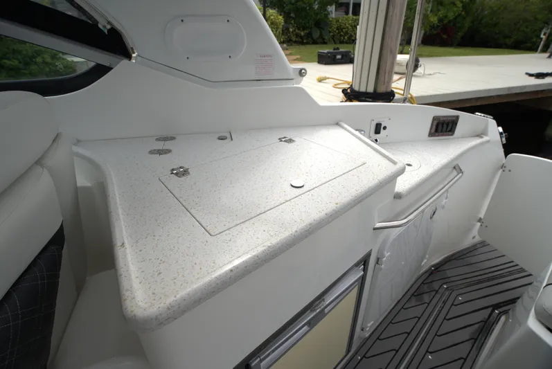  Yacht Photos Pics 2017 Rinker 320 Express Cruiser interior with sleek countertop and modern design.