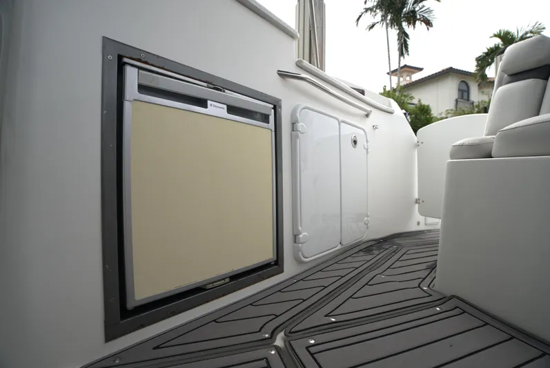  Yacht Photos Pics 2017 Rinker 320 Express Cruiser deck with storage compartments and seating.