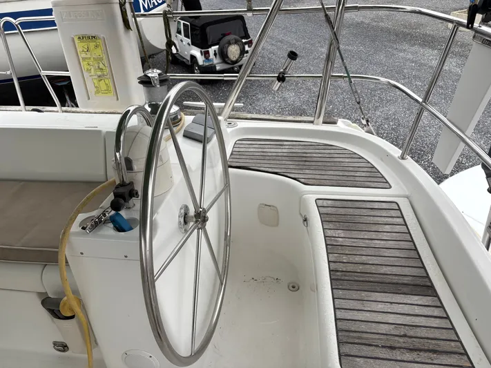 At Last Yacht Photos Pics Beneteau Oceanis 473 sailboat cockpit with steering wheel, 2004 model.