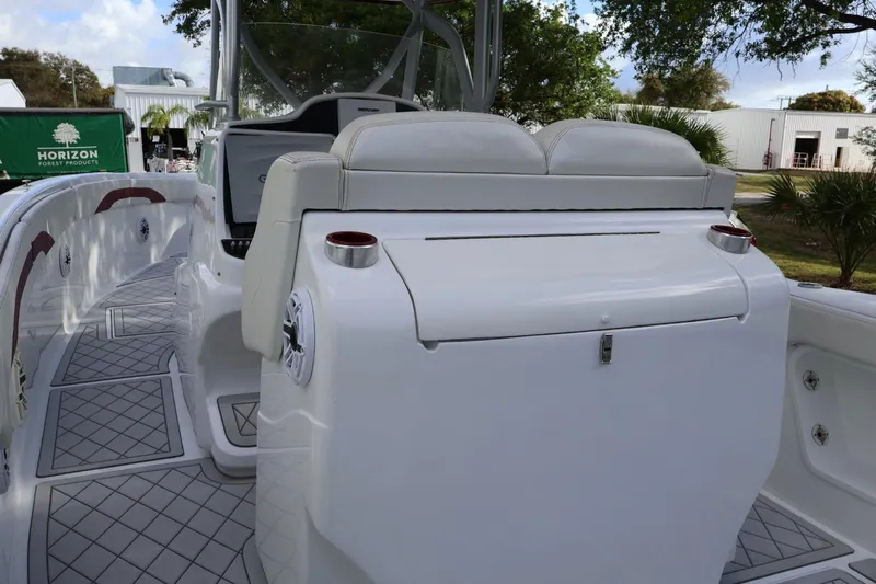  Yacht Photos Pics 2015 Deep Impact 33 boat interior with seating and cup holders, showcasing luxury design.