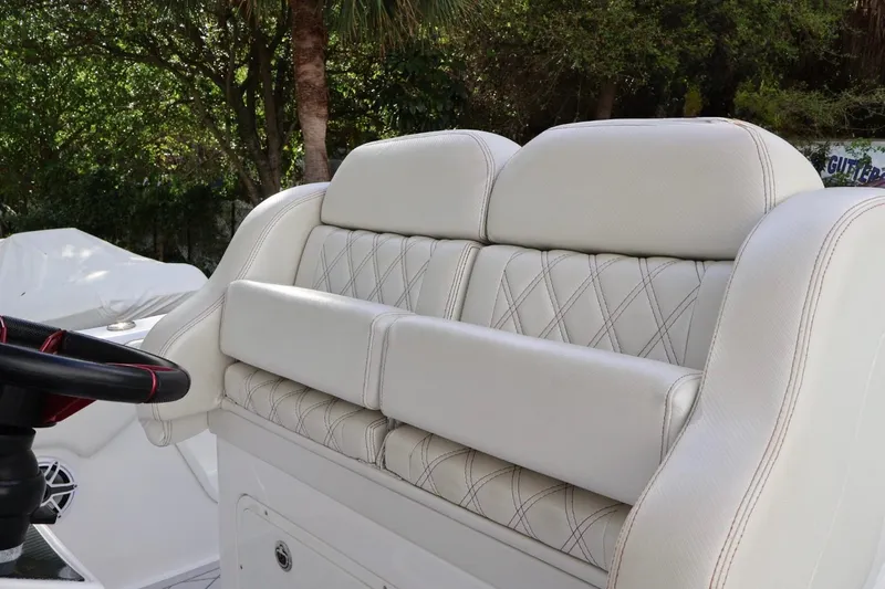  Yacht Photos Pics Luxurious seating on a 2015 Deep Impact 33 boat, featuring elegant white upholstery.