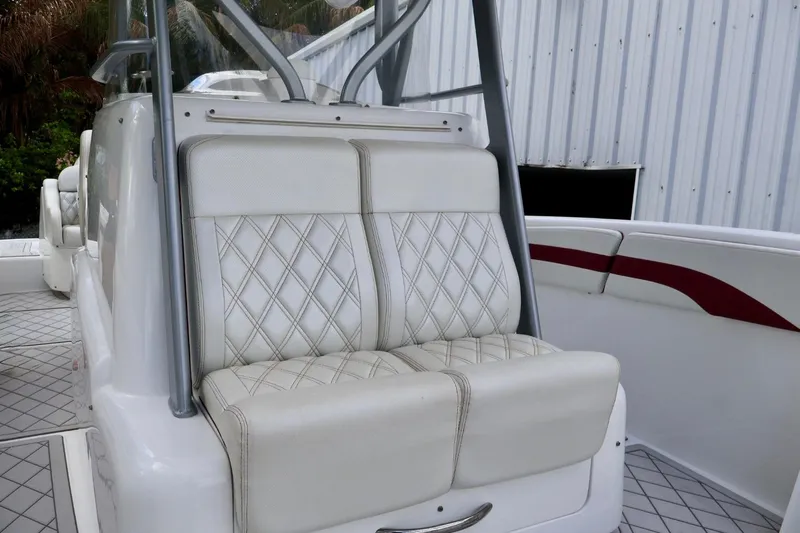  Yacht Photos Pics 2015 Deep Impact 33 boat with white diamond-stitched seating and sleek design.