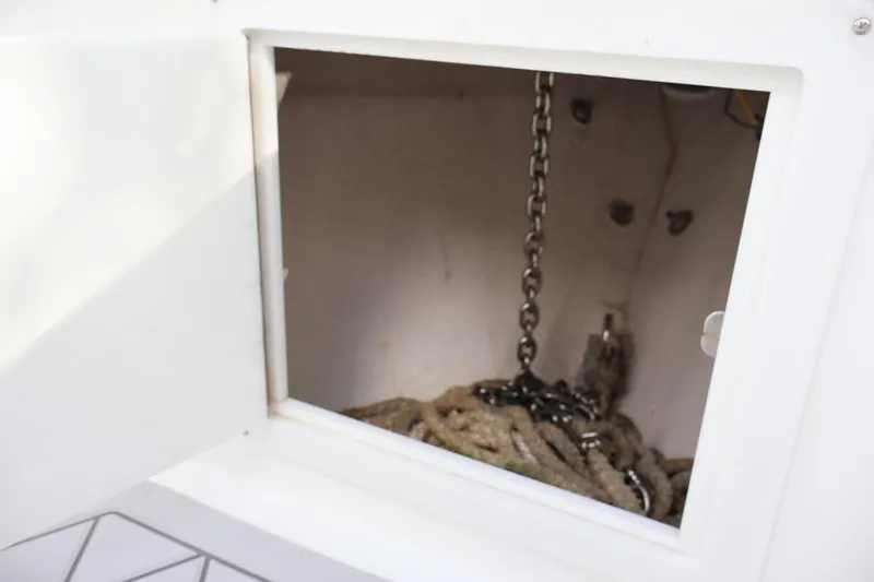  Yacht Photos Pics Storage compartment with chain and rope on a 2015 Deep Impact 33 boat.