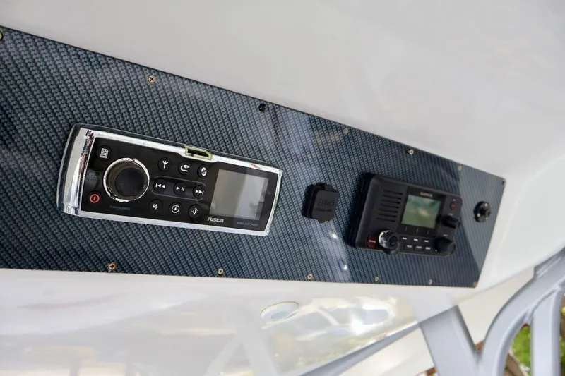  Yacht Photos Pics Control panel of 2015 Deep Impact 33 boat with audio and navigation systems.