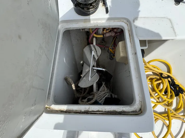 Eirene Yacht Photos Pics Anchor storage compartment on 2001 Mainship 390 boat with ropes and cables.