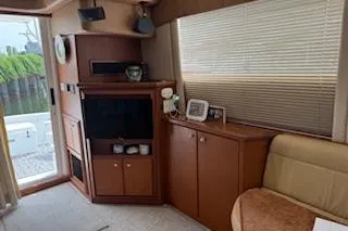  Yacht Photos Pics Interior of 2006 Silverton 42 Convertible yacht with cozy seating and entertainment area.