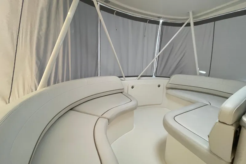  Yacht Photos Pics Interior seating area of a 2006 Silverton 42 Convertible yacht with gray upholstery.