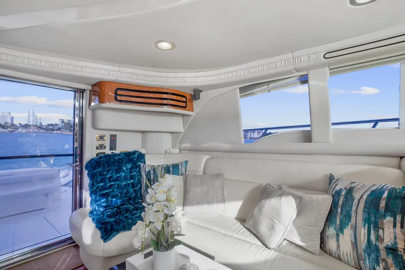 Our Trade Yacht Photos Pics Luxurious interior of 2001 Sea Ray 480 Sedan Bridge yacht with plush seating and elegant decor.