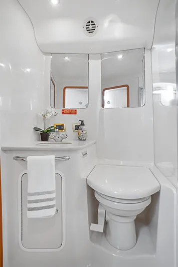 Our Trade Yacht Photos Pics Luxurious bathroom in 2001 Sea Ray 480 Sedan Bridge yacht, featuring modern fixtures and elegant design.