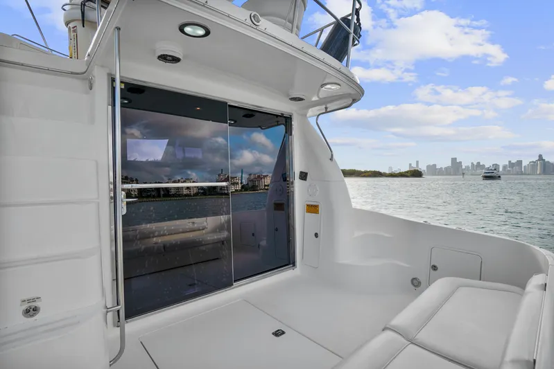 Our Trade Yacht Photos Pics 2001 Sea Ray 480 Sedan Bridge yacht deck with city skyline view.