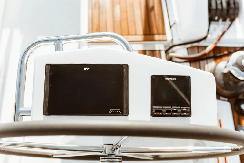  Yacht Photos Pics Steering console of 2024 Beneteau Oceanis 46.1 yacht with navigation instruments.