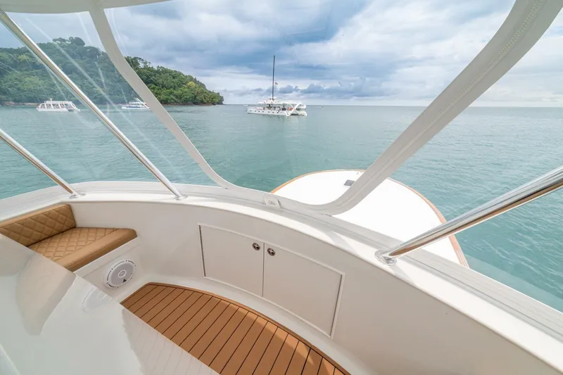 Annie Girl Yacht Photos Pics Custom Carolina 49 Ricky Gillikan yacht interior, 1997 model, overlooking serene ocean and distant boats.