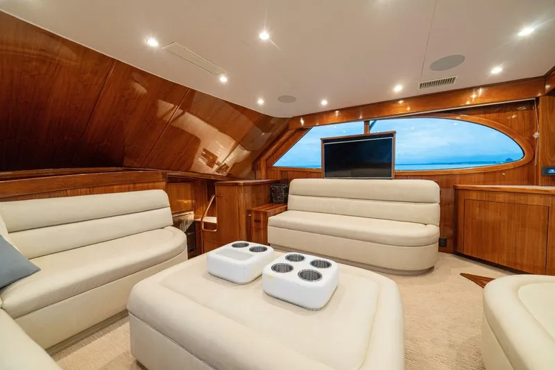 Annie Girl Yacht Photos Pics Luxurious interior of 1997 Custom Carolina 49 Ricky Gillikan yacht with plush seating and wood finish.