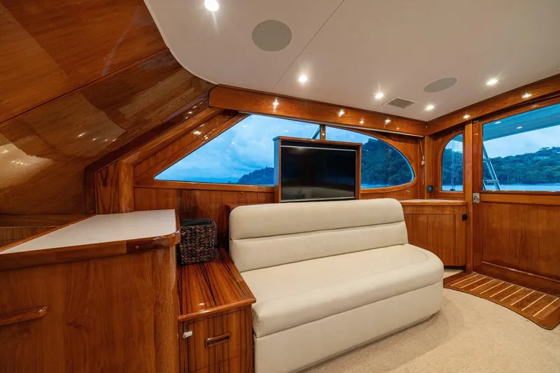 Annie Girl Yacht Photos Pics Luxurious interior of 1997 Custom Carolina 49 Ricky Gillikan yacht with elegant wood finish.