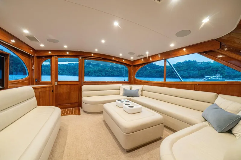 Annie Girl Yacht Photos Pics Luxurious interior of 1997 Custom Carolina 49 Ricky Gillikan yacht with elegant seating and wood accents.