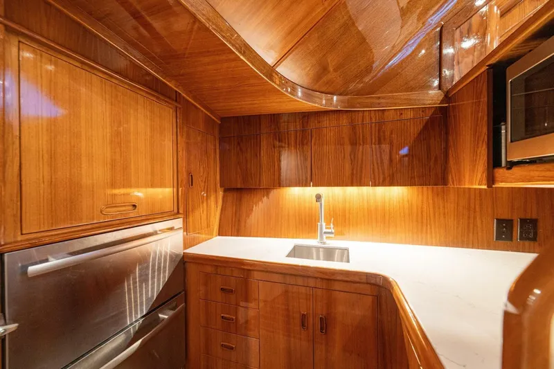Annie Girl Yacht Photos Pics Luxurious wooden kitchen interior on 1997 Custom Carolina 49 Ricky Gillikan yacht.