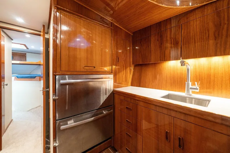 Annie Girl Yacht Photos Pics Luxurious wooden interior of 1997 Custom Carolina 49 Ricky Gillikan yacht kitchen.