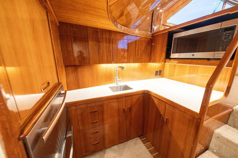 Annie Girl Yacht Photos Pics Luxurious wooden kitchen interior of 1997 Custom Carolina 49 Ricky Gillikan yacht.
