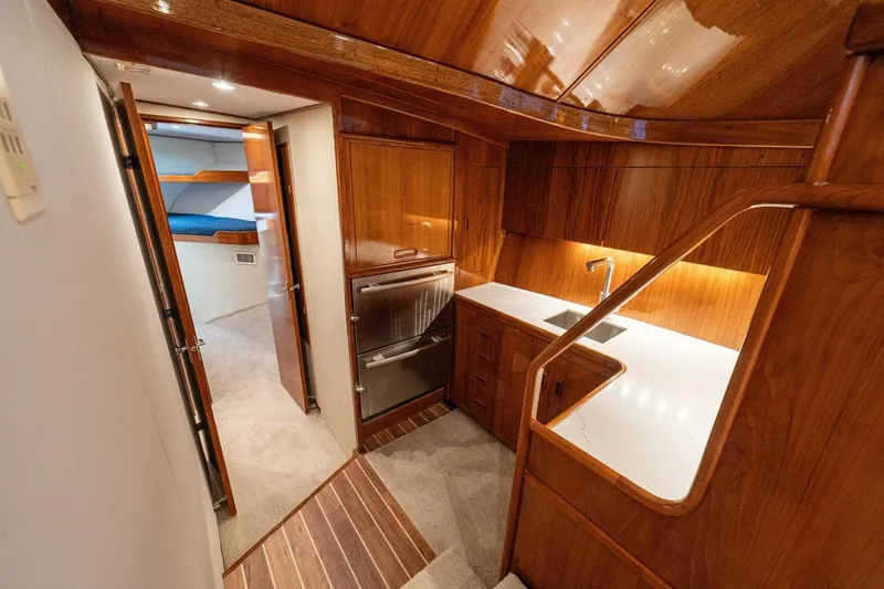 Annie Girl Yacht Photos Pics Luxurious 1997 Custom Carolina 49 Ricky Gillikan yacht interior with wood finish and modern amenities.
