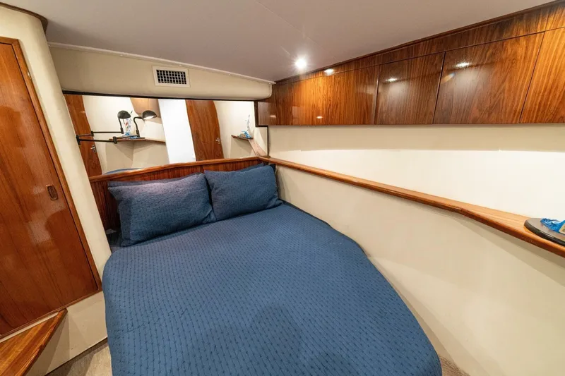 Annie Girl Yacht Photos Pics Luxurious cabin interior of 1997 Custom Carolina 49 Ricky Gillikan yacht with wooden cabinetry.