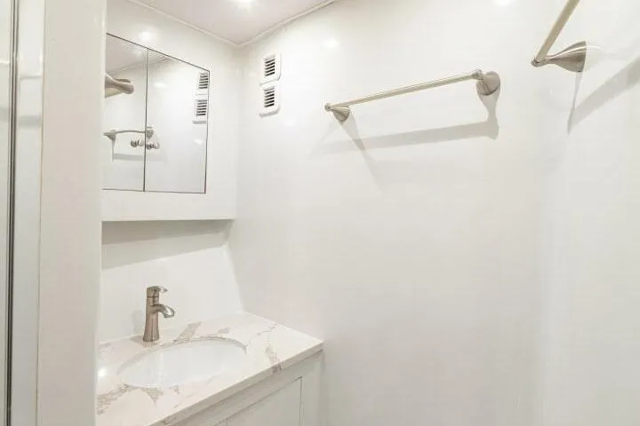 Annie Girl Yacht Photos Pics Luxurious bathroom in 1997 Custom Carolina 49 Ricky Gillikan yacht, featuring modern fixtures.