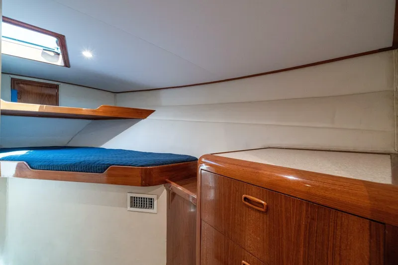 Annie Girl Yacht Photos Pics Cozy cabin interior of 1997 Custom Carolina 49 Ricky Gillikan with wooden furnishings.