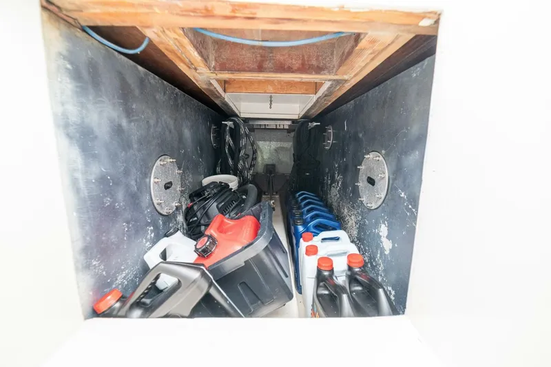Annie Girl Yacht Photos Pics Storage compartment on 1997 Custom Carolina 49 Ricky Gillikan boat with fuel containers and equipment.