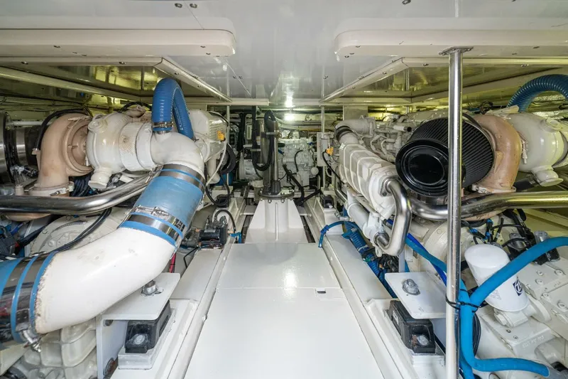 Annie Girl Yacht Photos Pics Engine room of 1997 Custom Carolina 49 Ricky Gillikan boat, featuring dual engines and piping.
