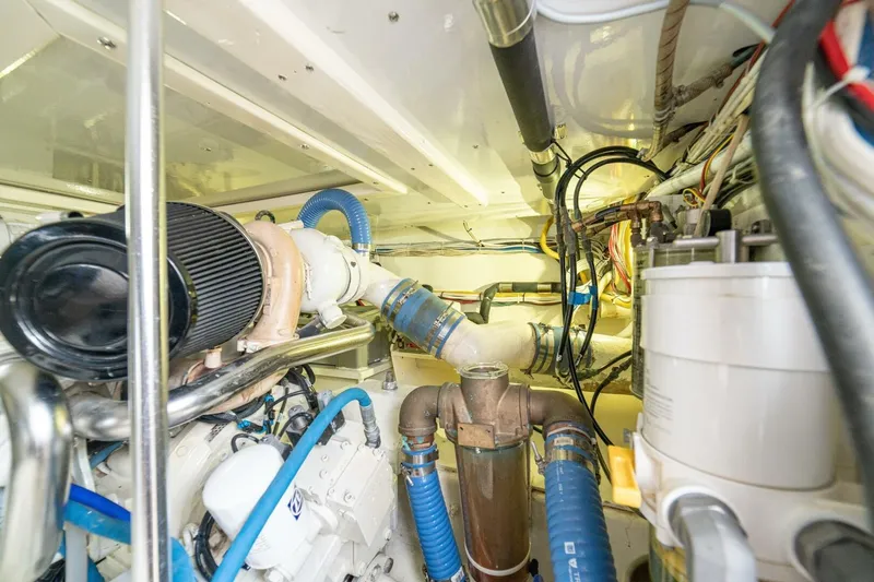 Annie Girl Yacht Photos Pics Engine room of 1997 Custom Carolina 49 Ricky Gillikan boat, featuring complex piping and machinery.