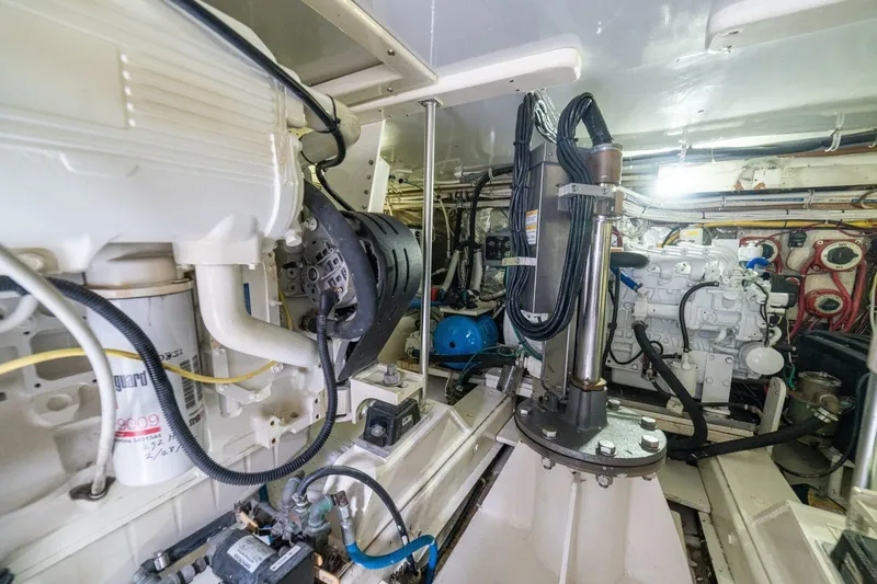 Annie Girl Yacht Photos Pics Engine room of 1997 Custom Carolina 49 Ricky Gillikan boat, showcasing mechanical components and wiring.