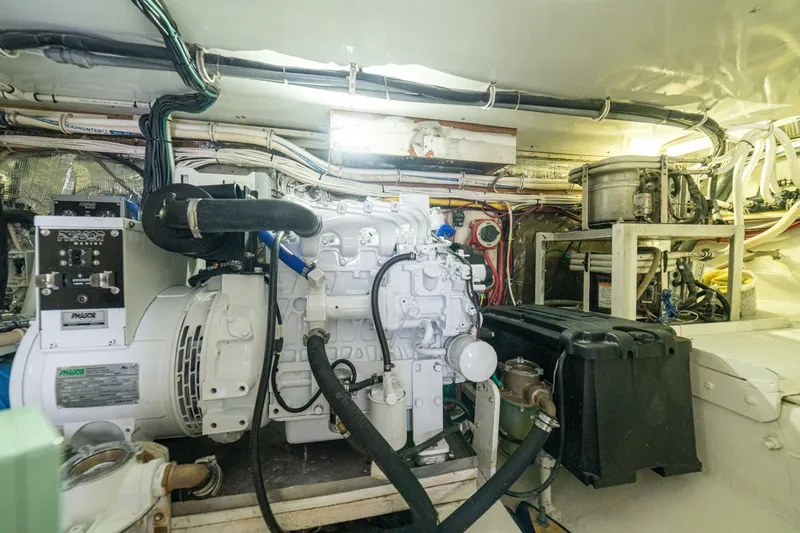 Annie Girl Yacht Photos Pics Engine room of 1997 Custom Carolina 49 Ricky Gillikan boat, featuring complex machinery and wiring.