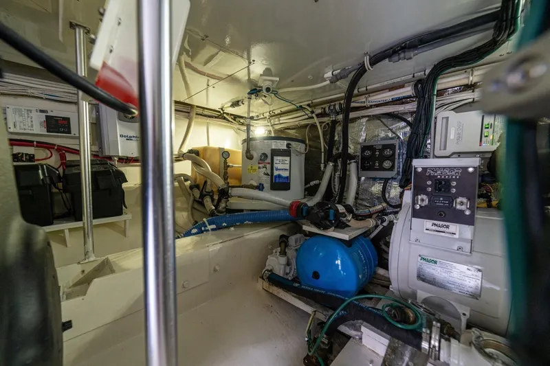 Annie Girl Yacht Photos Pics Engine room of 1997 Custom Carolina 49 Ricky Gillikan boat, showcasing equipment and wiring.