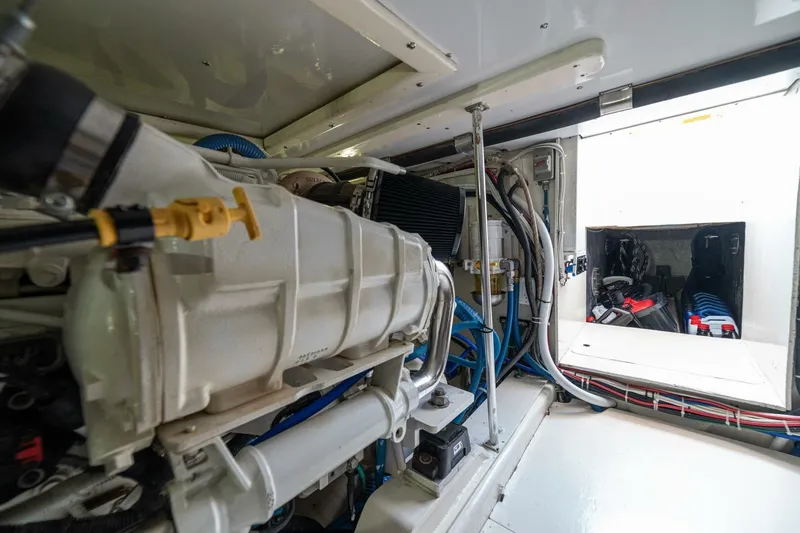 Annie Girl Yacht Photos Pics Engine room of 1997 Custom Carolina 49 Ricky Gillikan boat, showcasing mechanical components.