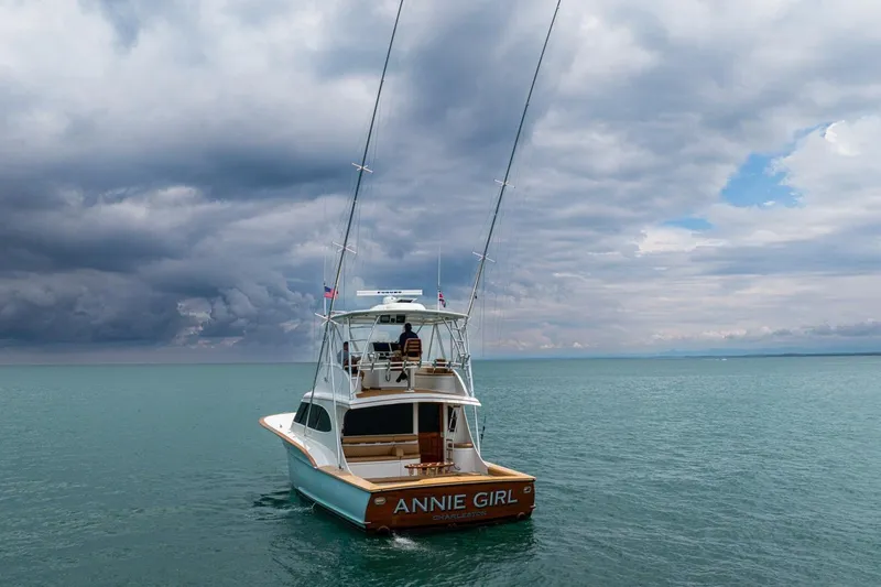 Annie Girl Yacht Photos Pics Custom Carolina 49 Ricky Gillikan yacht, "Annie Girl," on open water under cloudy skies.
