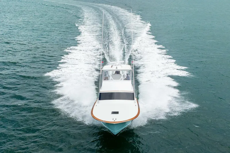 Annie Girl Yacht Photos Pics Custom Carolina 49 Ricky Gillikan 1997 boat cruising on open water, aerial view.