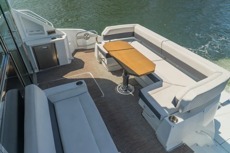 Duke Yacht Photos Pics Luxurious 2018 Cruisers Yachts 50 Cantius deck with elegant seating and table.