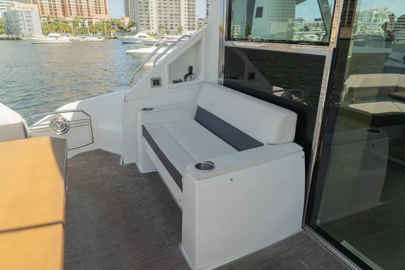 Duke Yacht Photos Pics 2018 Cruisers Yachts 50 Cantius, outdoor seating area with waterfront view.