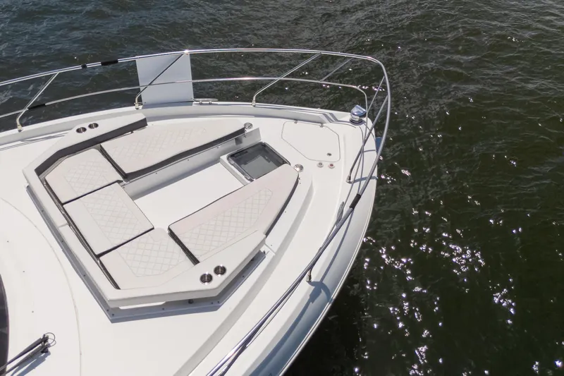 Duke Yacht Photos Pics 2018 Cruisers Yachts 50 Cantius bow with sunpads on water.