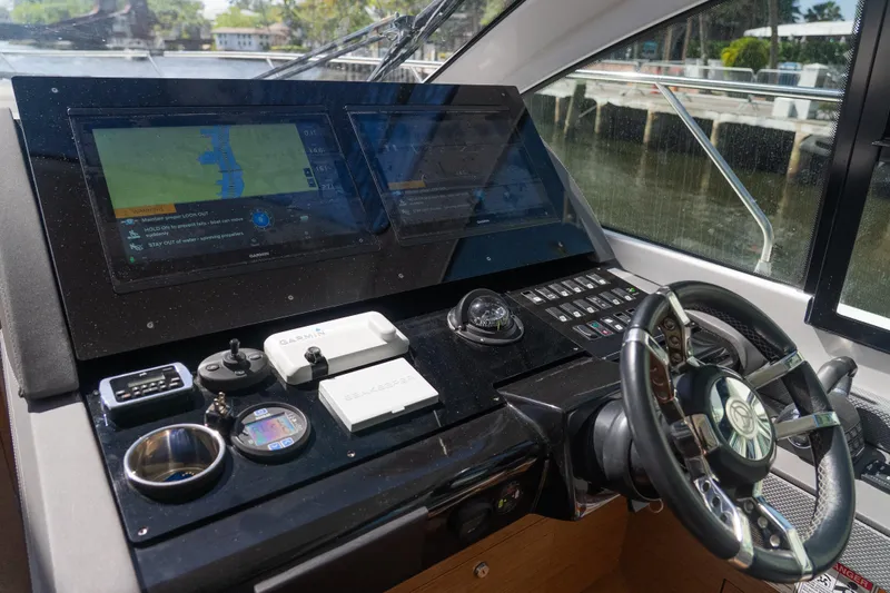 Duke Yacht Photos Pics Helm of 2018 Cruisers Yachts 50 Cantius with advanced navigation displays and controls.