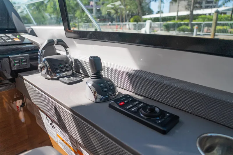 Duke Yacht Photos Pics Control panel of 2018 Cruisers Yachts 50 Cantius with joystick and throttle controls.